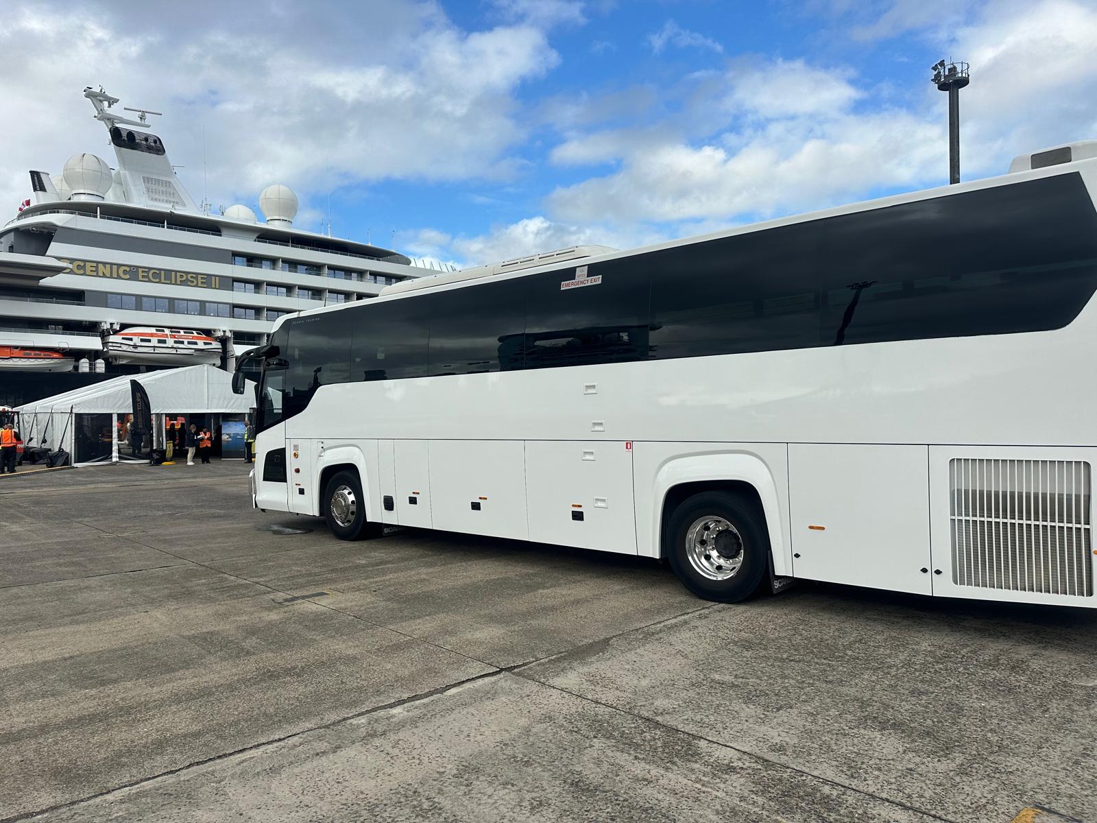 A full-size coach, front three-quarter view