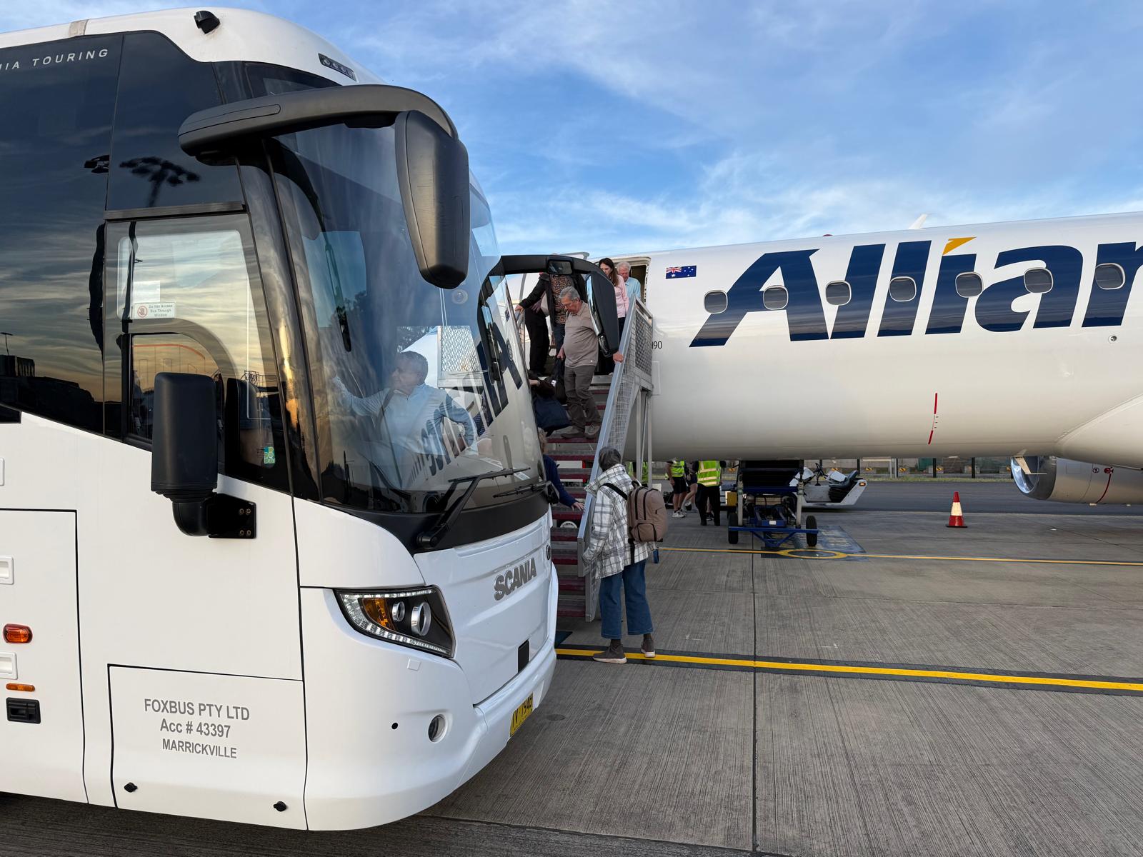 A coach at an airport terminal kerbside