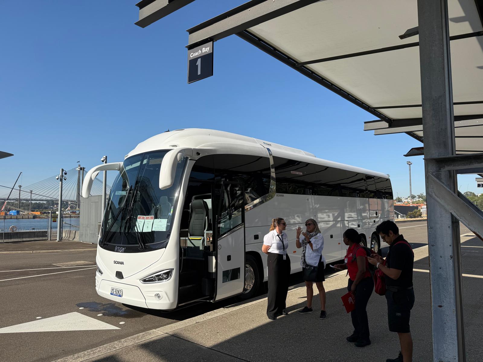 A group boarding a coach for a corporate transfer