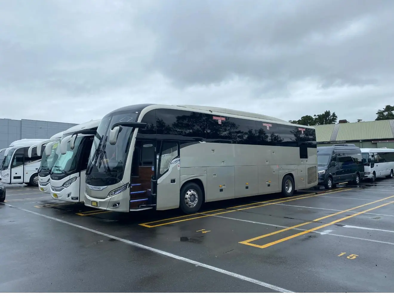 Several coaches parked side by side at the depot